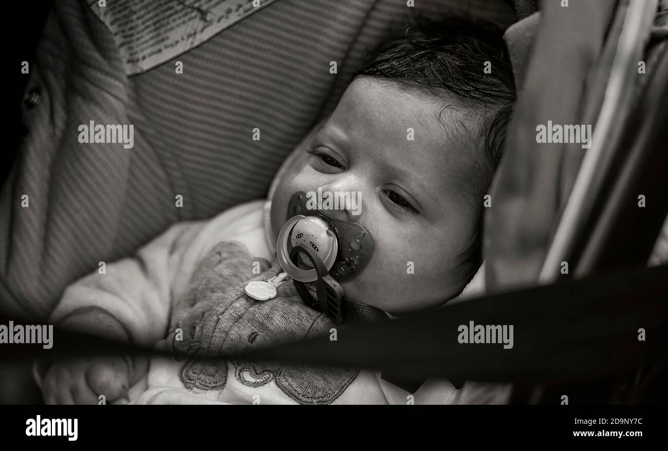 Newborn baby sleeps in the cot, black and white image Stock Photo Alamy