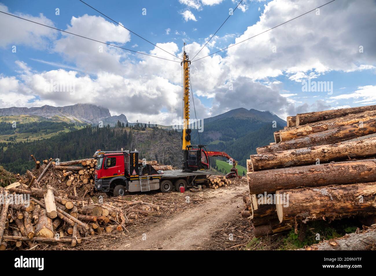 forestry work, special vehicle with tower and cableway for the recovery and processing of tree trunks, dolomites, italy, europe Stock Photo