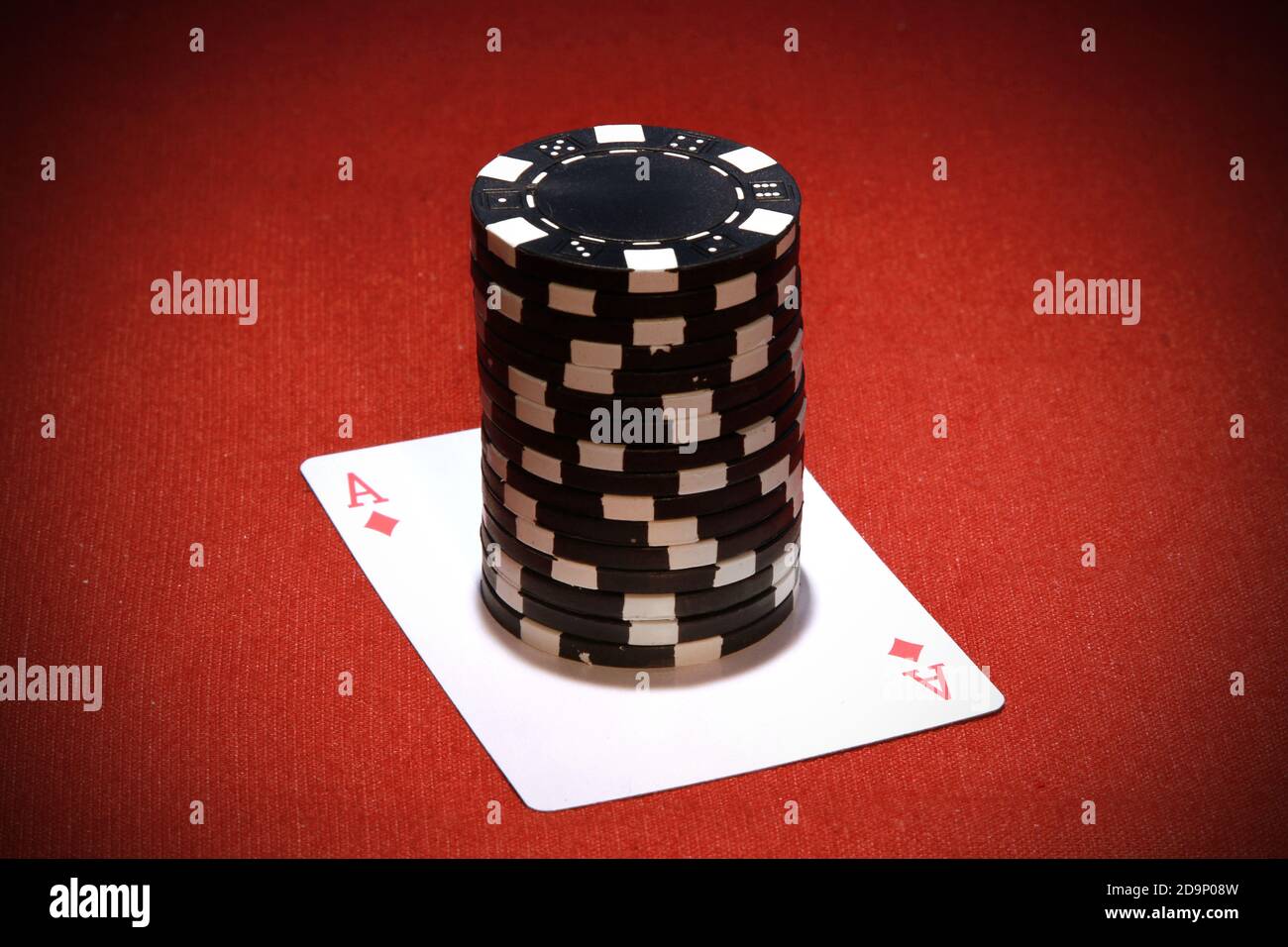 A stack of black poker chips on a red ace card Stock Photo - Alamy