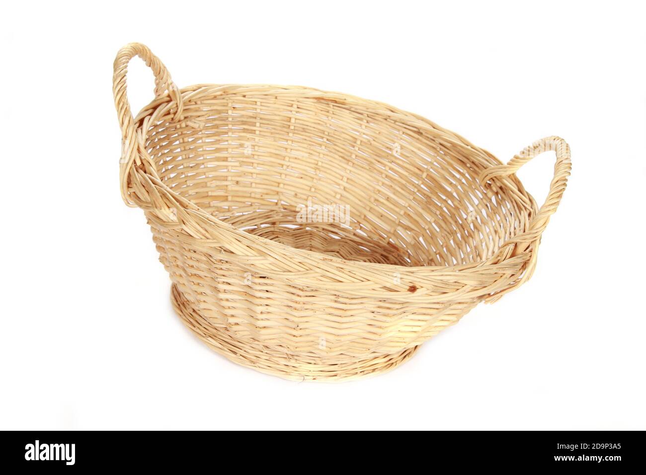 A woven wicker basket isolated on a white background Stock Photo - Alamy