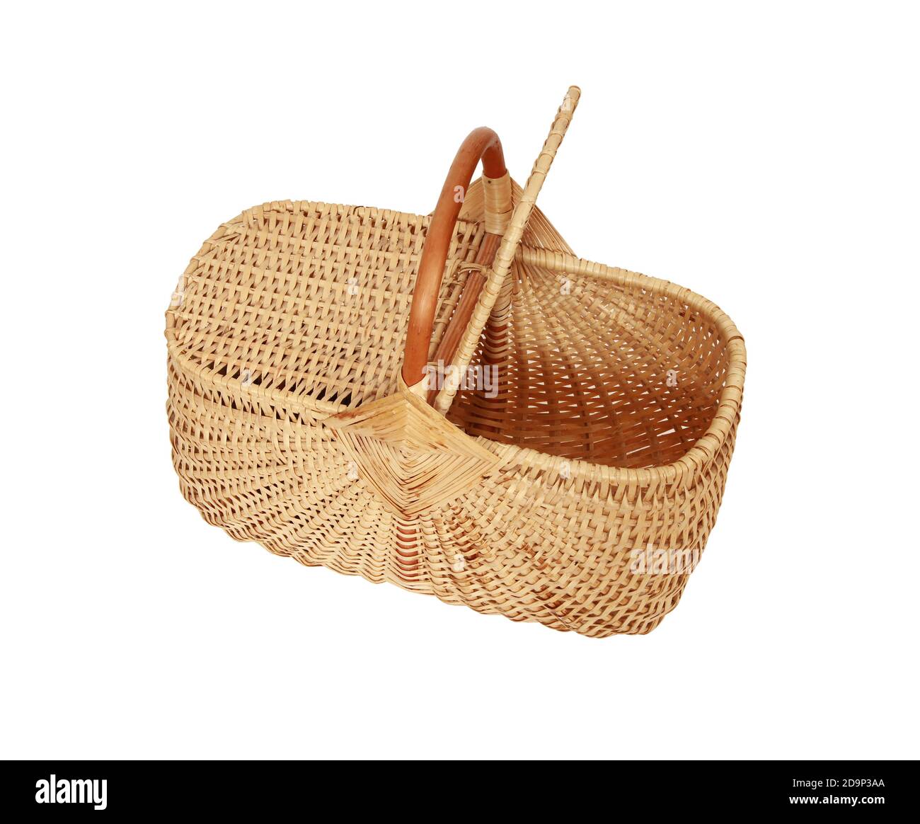 A woven wicker basket with a handle and a lid isolated on a white ...