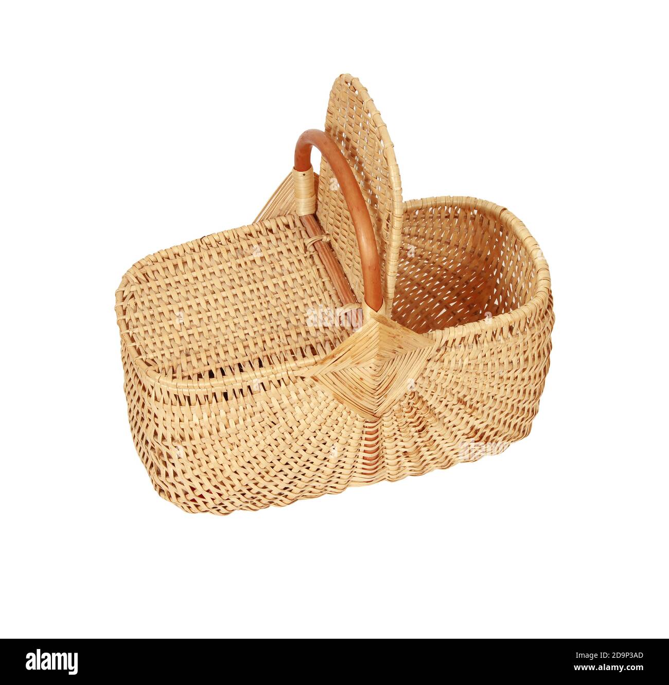 A woven wicker basket with a handle and a lid isolated on a white ...