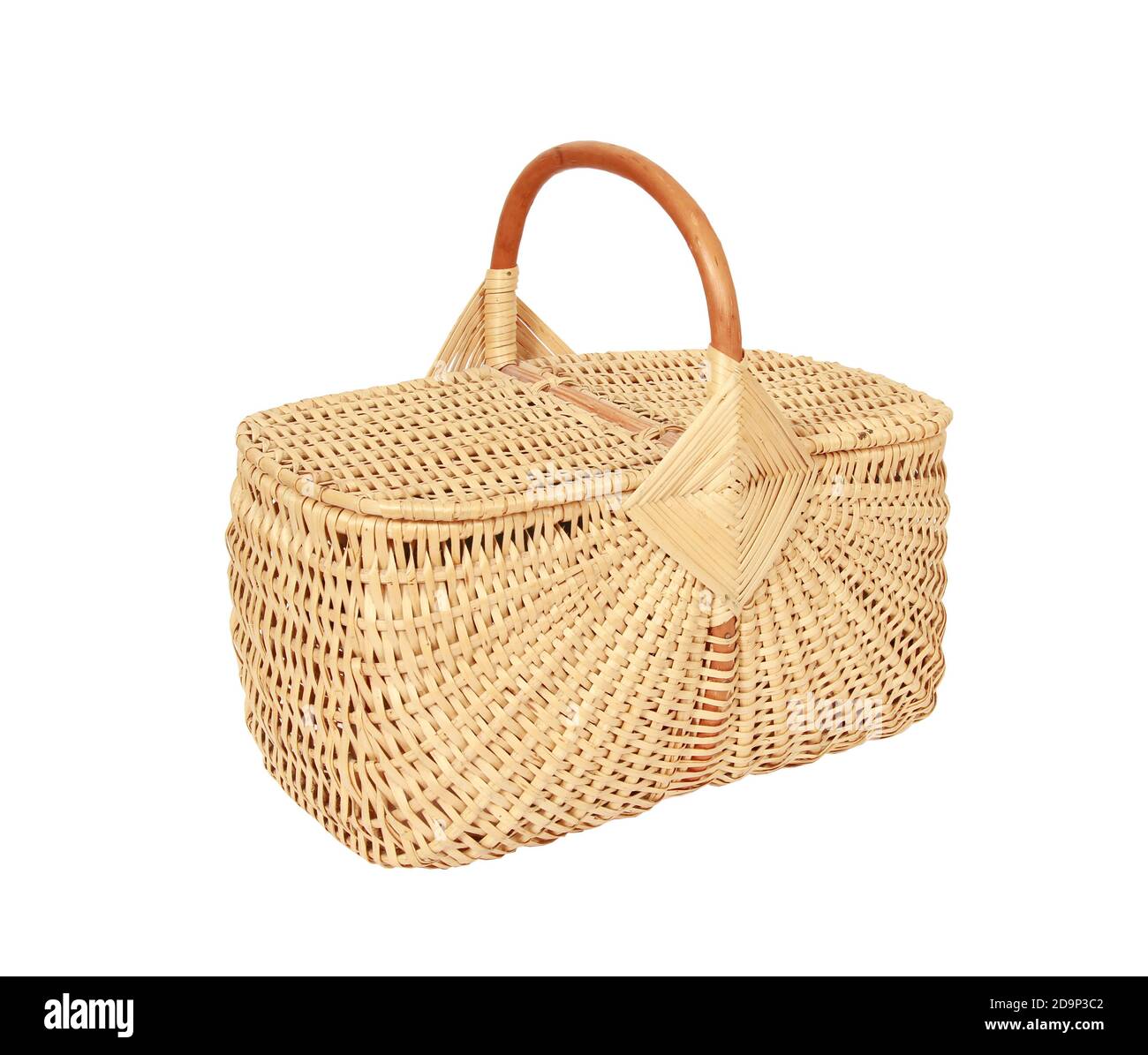 A woven wicker basket with a handle and a lid isolated on a white ...