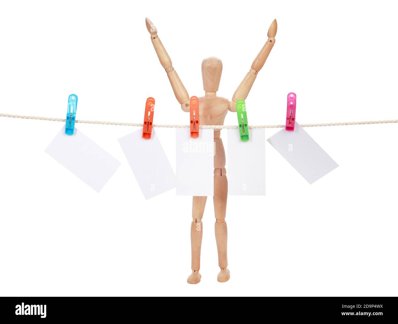 Closeup shot of a wooden figure with sample text papers isolated on a ...