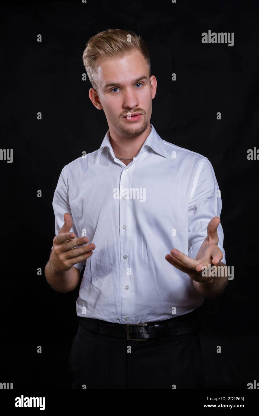 Young man dressed in white shirt studio portrait Stock Photo - Alamy
