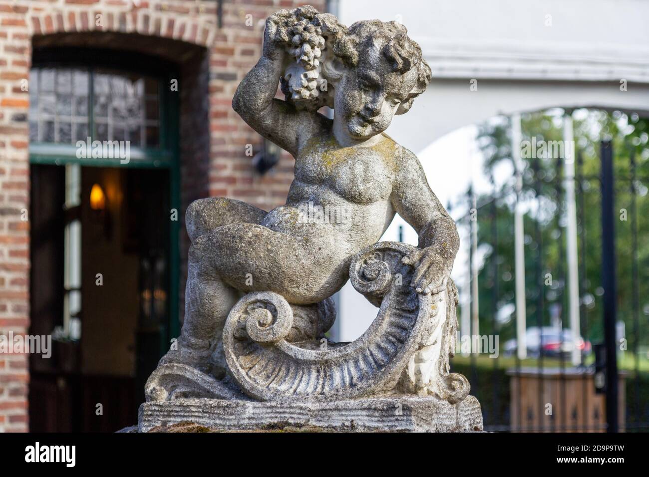 Stone statue of a boy Stock Photo