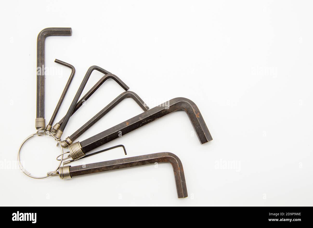 A set of hex keys hanging on ring on a white background Stock Photo Alamy