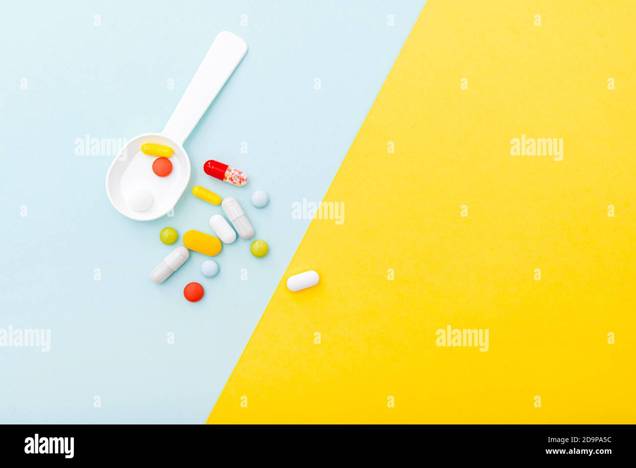 Medical composition with color pills, drugs, top view. Set of capsules