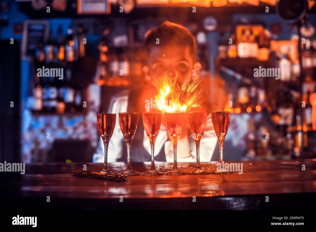 Barman concocts a cocktail in the beerhall Stock Photo