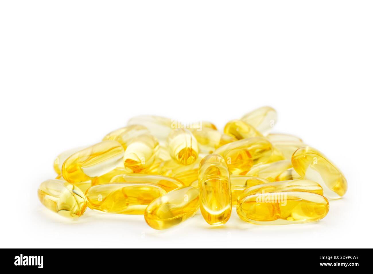 Closeup of capsules fish oil with Omega 3 on white background. Shallow
