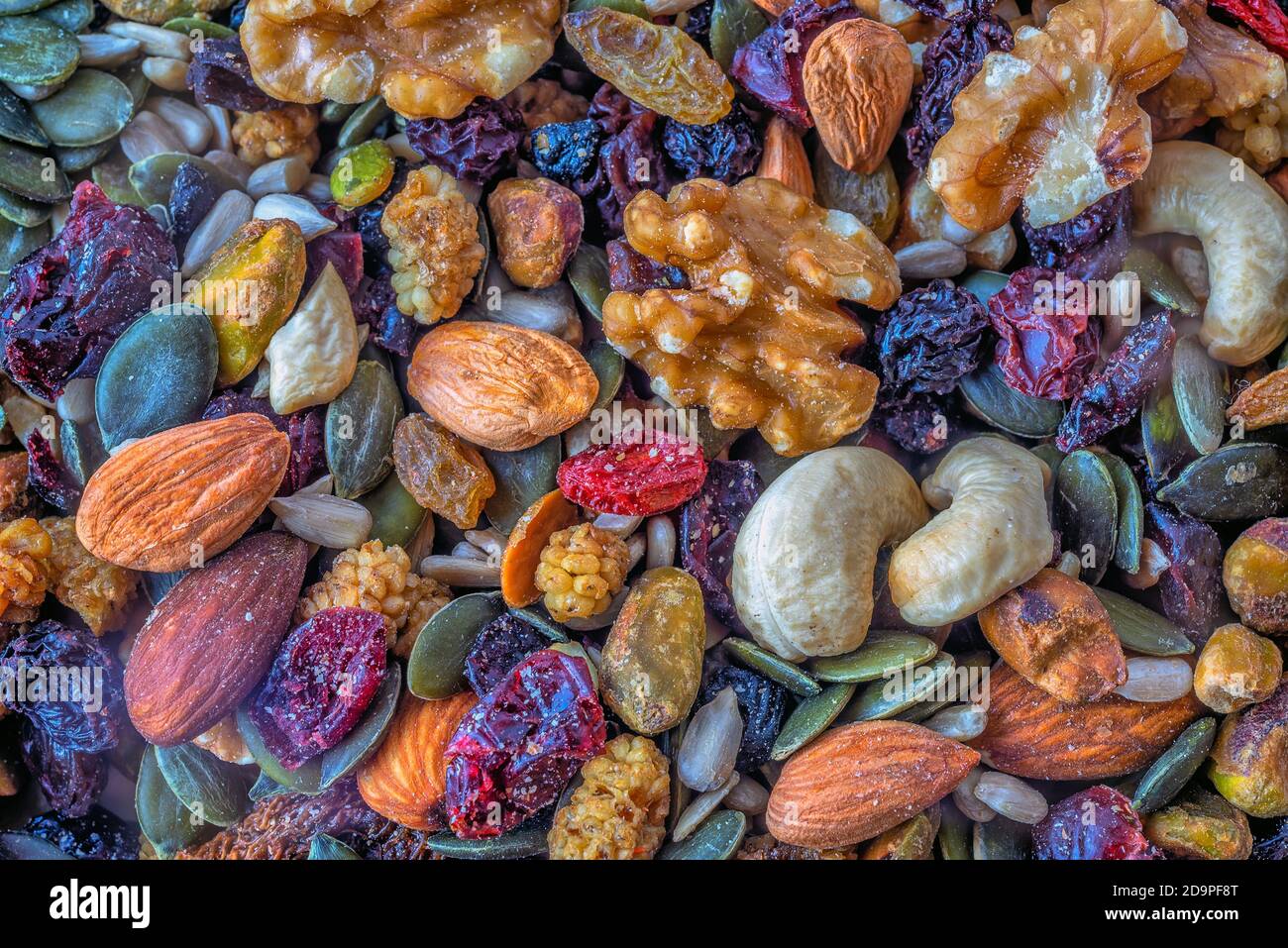 Healthy trail mix made up of nuts, seeds and raisins Stock Photo - Alamy