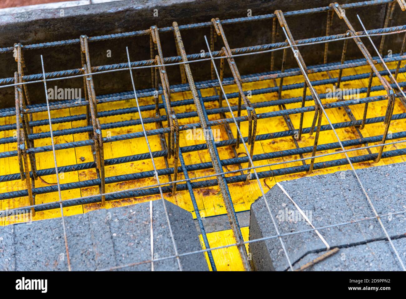 Reinforced concrete slab with lightweight concrete blocks under