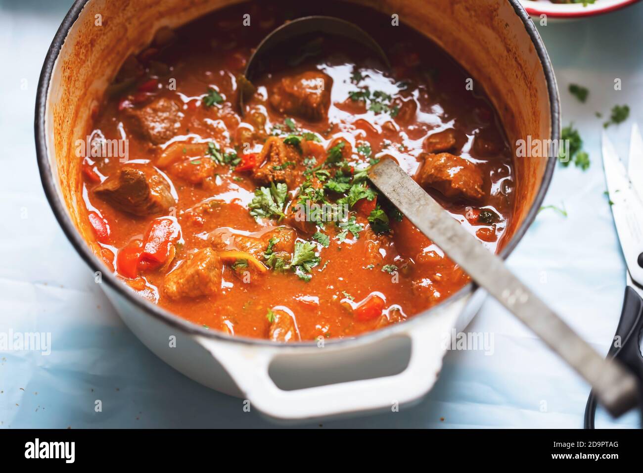 Beef goulash with paprika, tomatoes and parsley Stock Photo Alamy
