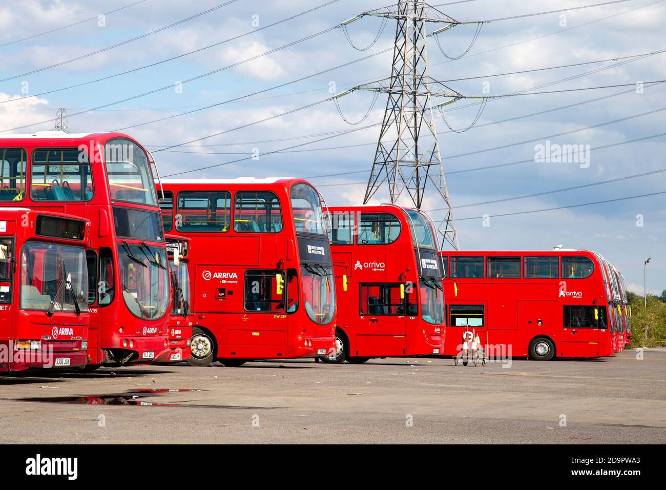 Red double-decker busses parked at the Arriva North London Bus Depot by River Lee Navigation Canal, Lee Valley, London, UK Stock Photo