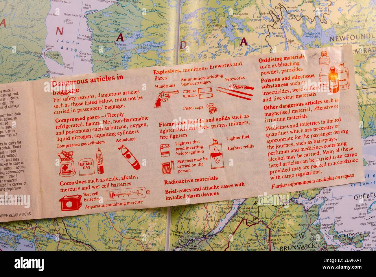 Inside page showing dangerous baggage items information of a plane ticket from 1989 (for flights between the UK and Canada) on a map of Canada.. Stock Photo