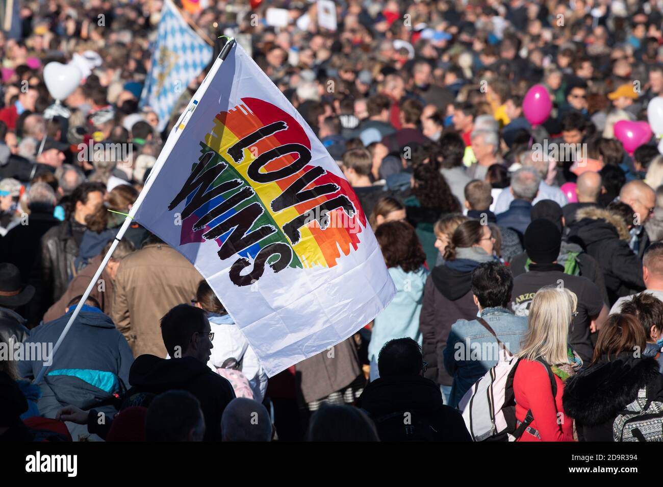 Leipzig, Germany. 07th Nov, 2020. 'Love wins' is written on a colourful flag held on Augustusplatz by a participant in the demonstration of the Stuttgart initiative 'Lateral thinking'. Several thousand people are taking part in the rally against the Corona measures decided by the federal and state governments. Credit: Sebastian Kahnert/dpa-Zentralbild/dpa/Alamy Live News Stock Photo