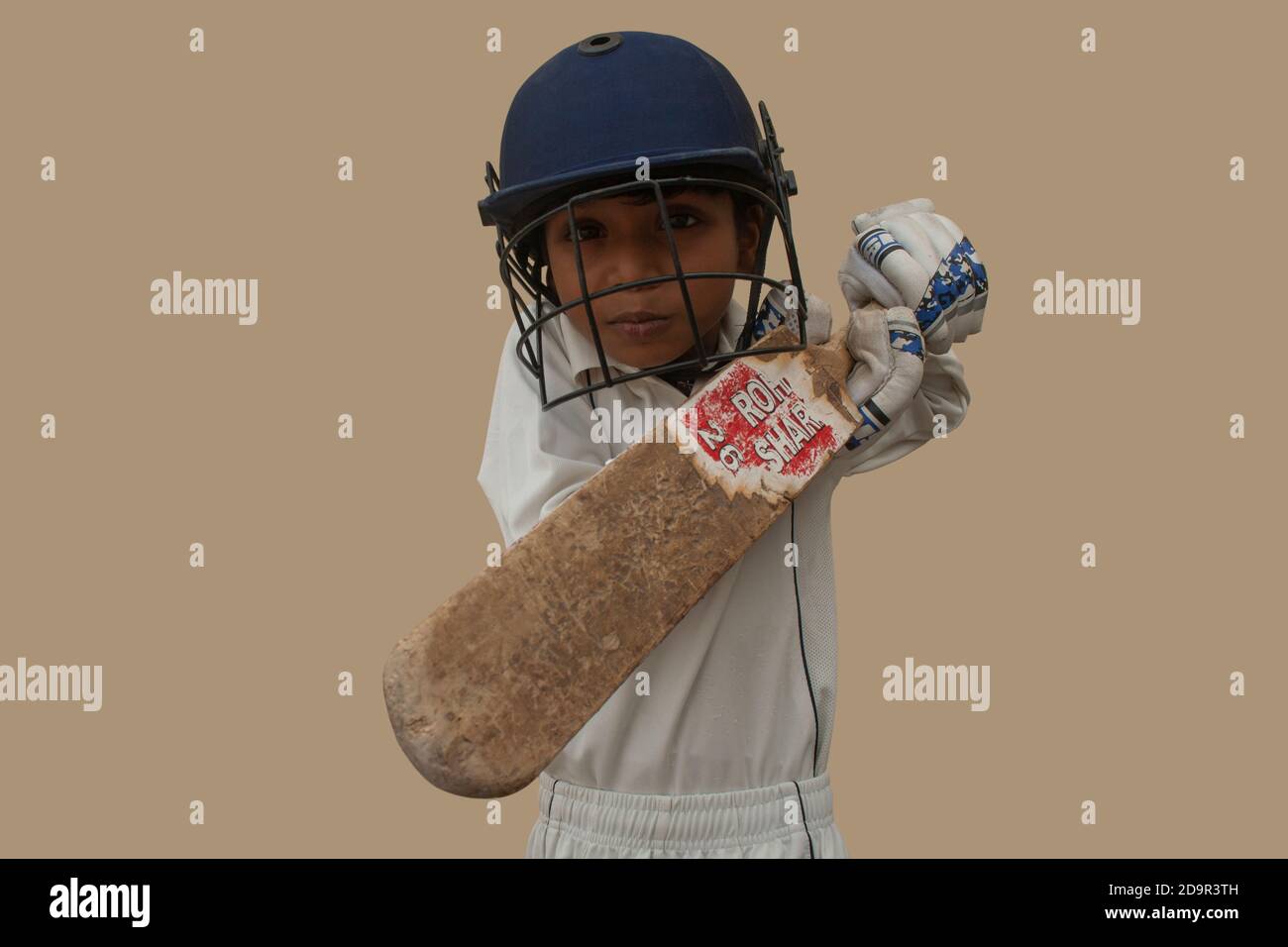 Portrait of boy Playing cricket Stock Photo Alamy