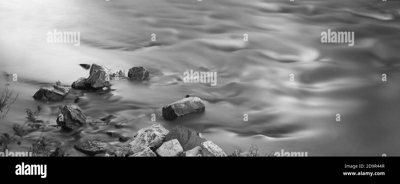 Surreal black and white photo of smooth water swirling around the ...