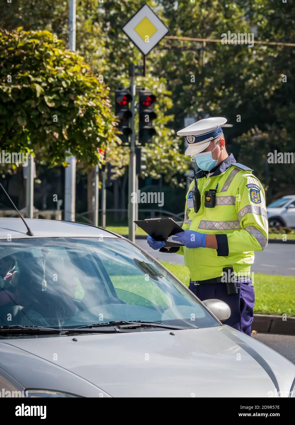 Woman police officer driving hi-res stock photography and images - Alamy