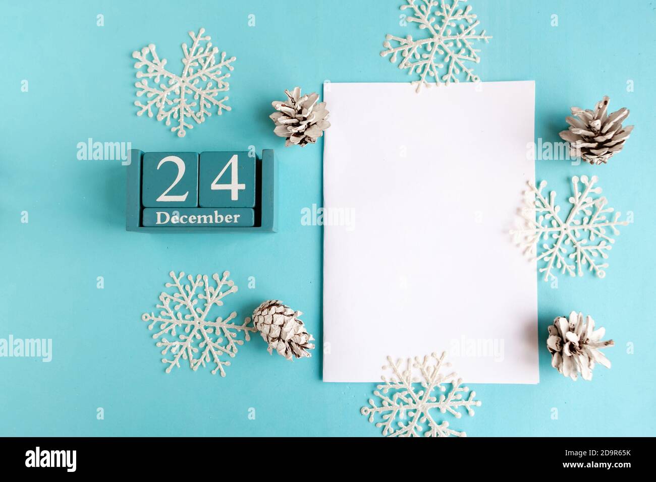 December 24. Blue cube calendar with month and date and white mockup ...