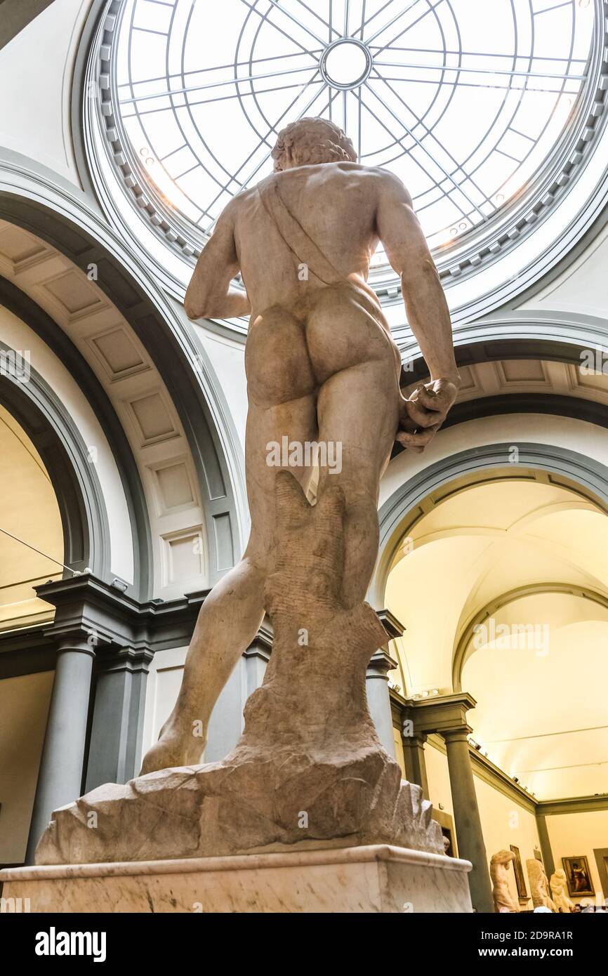 Created by the famous artist Michelangelo, the sling of the Biblical marble statue David is visible from the back. The sculpture is displayed under a... Stock Photo
