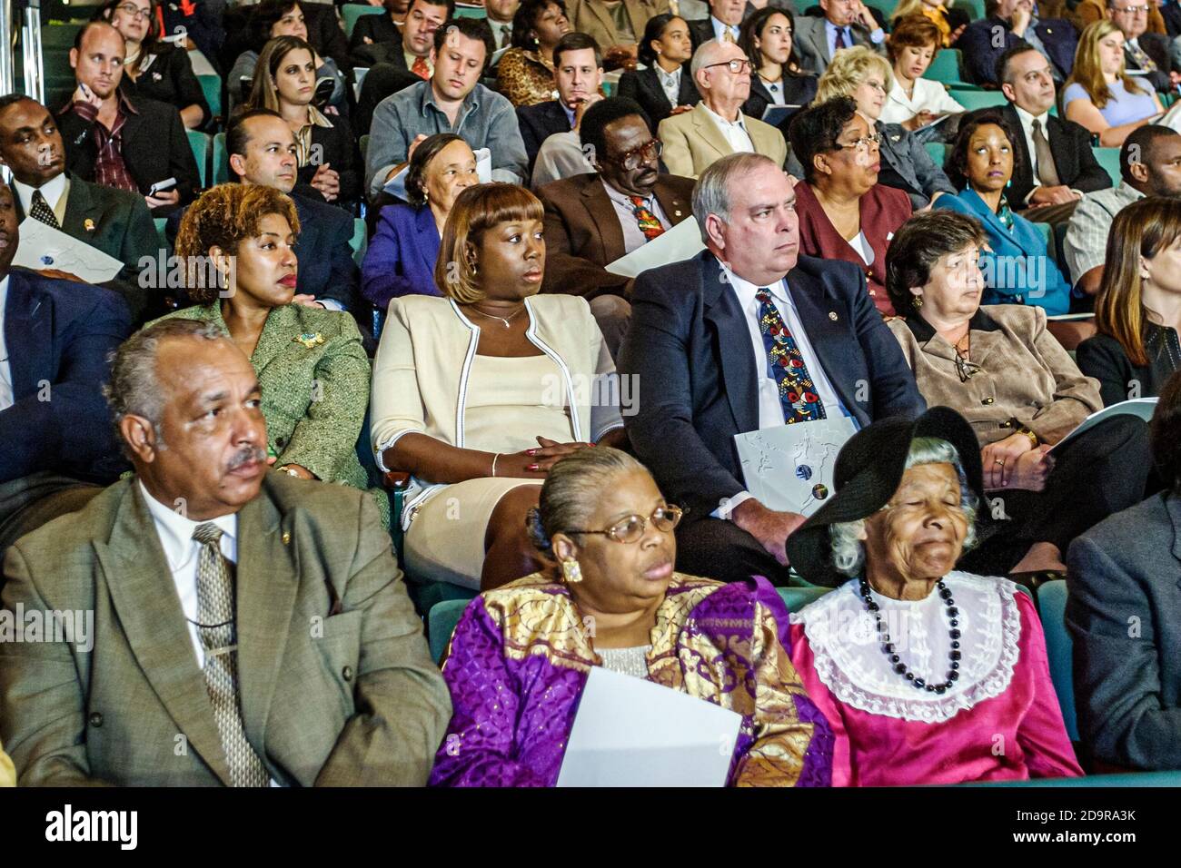 Miami Florida,Coral Gables University of Miami Gusman Hall,annual State of the County Address,audience crowd listens listening watches,Black man men w Stock Photo