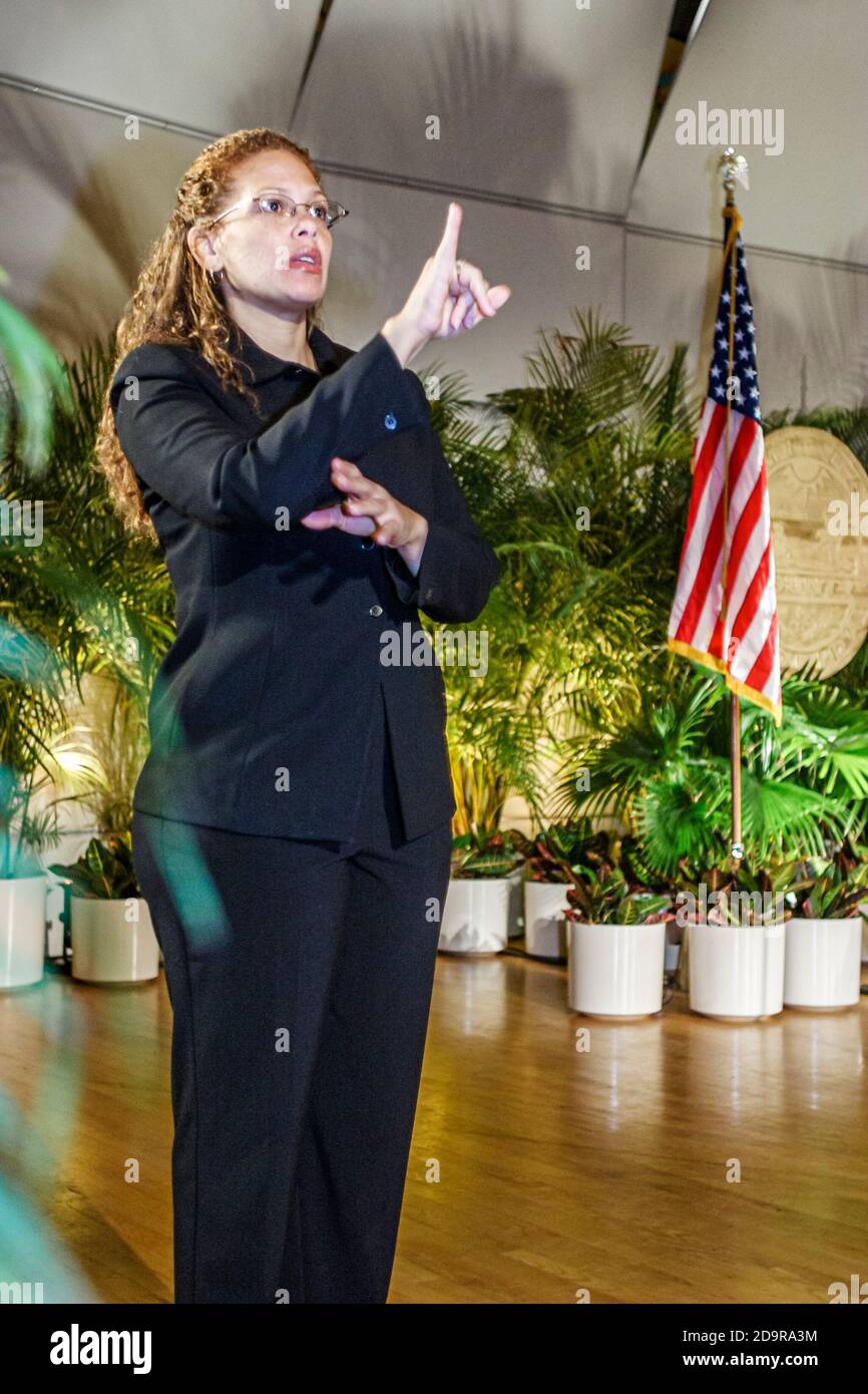 Miami Florida,Coral Gables University of Miami Gusman Hall,annual State of the County Address,woman female interpreter translates speech sign language Stock Photo