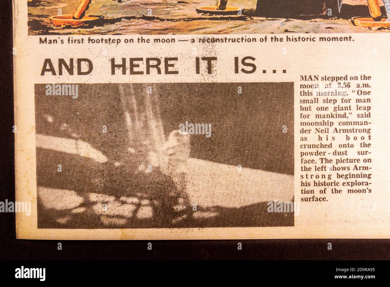 First step photo inside an Evening Standard souvenir newspaper (replica) for the Apollo 11 Moon landings on 21st July 1969. Stock Photo