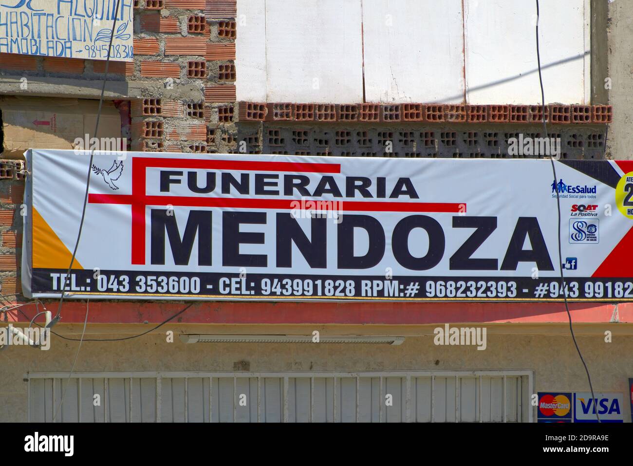 New Chimbote, Peru - April 18, 2018: Sign for company of funeral directors called Mendoza Stock Photo