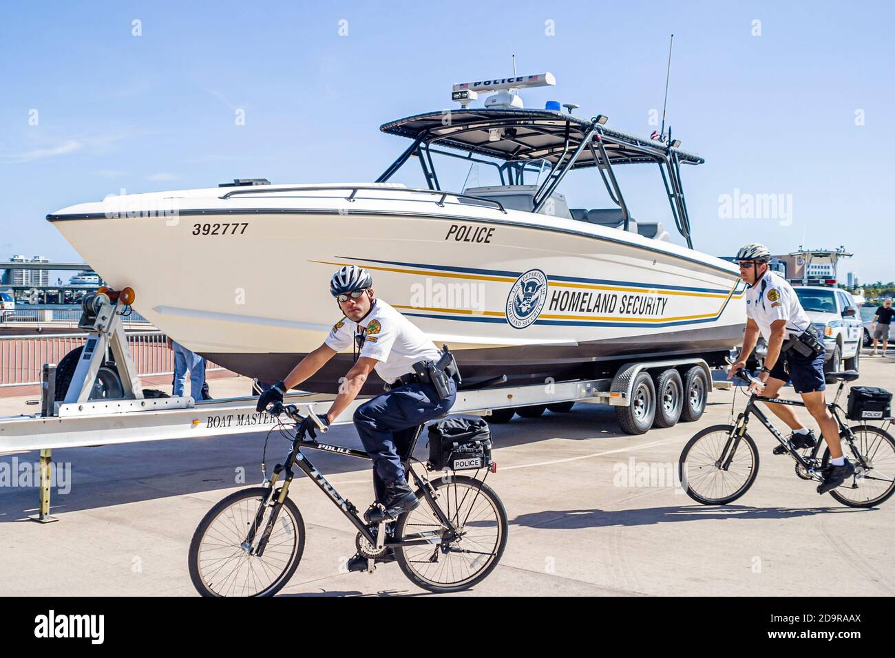 Miami Florida,Bayfront Park display exhibit,anti terrorism,Department of Homeland Security boat,law enforcement riding bicycles police policemen Stock Photo