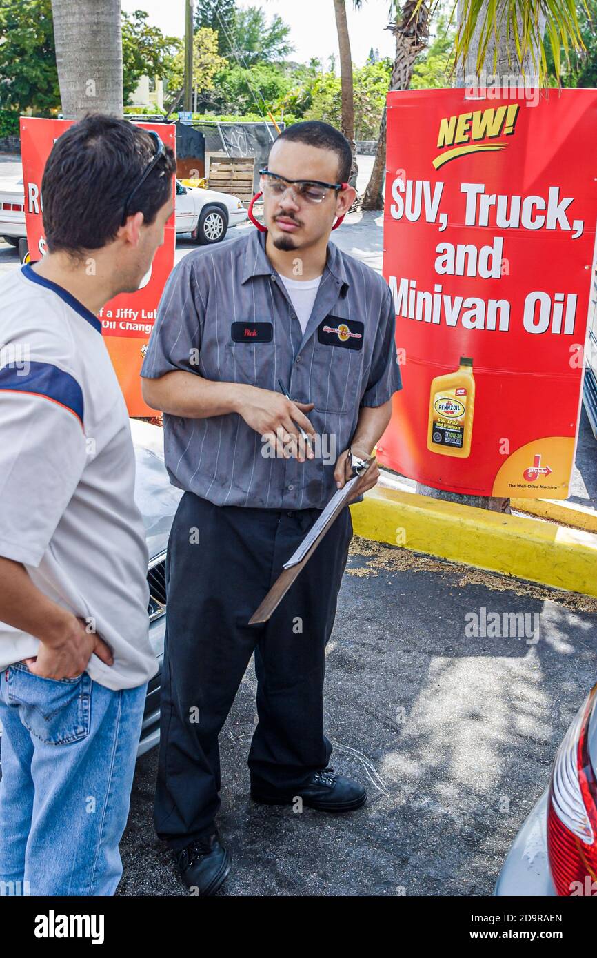 Miami Florida,Biscayne Boulevard Jiffy Lube,vehicle oil change business customer service manager employee,explains explaining offer offers offering, Stock Photo