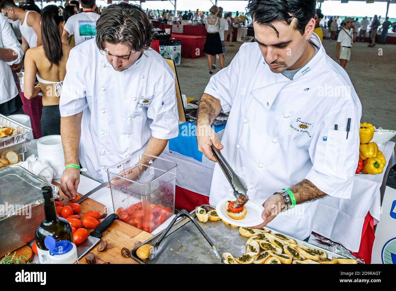 Miami Beach Florida,Wine & Food Festival,annual event tasting sampling celebrity chefs gourmet foods free samples,check baker preparing dessert, Stock Photo