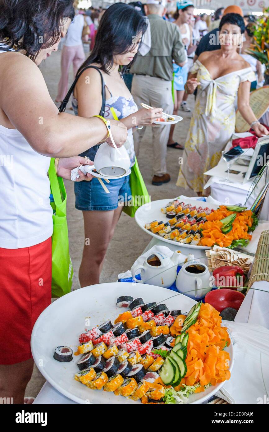 Miami Beach Florida,Wine & Food Festival,annual event tasting sampling celebrity chefs gourmet foods free samples,guests visitors sushi California rol Stock Photo