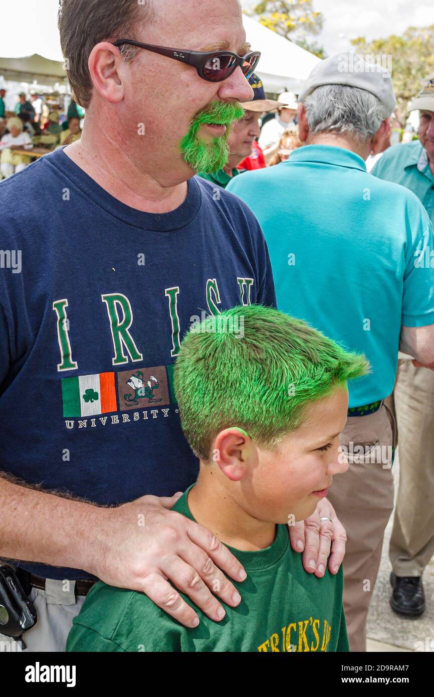 Miami Florida,Coral Gables Ponce Circle Park,St. Patrick's Day Festival annual Irish culture tradition wearing green father son dyed hair beard, Stock Photo
