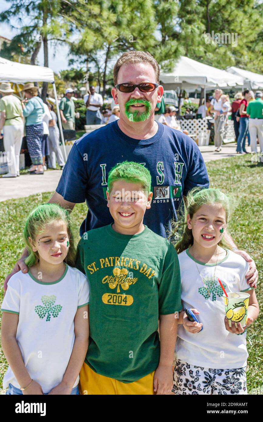 Miami Florida,Coral Gables Ponce Circle Park,St. Patrick's Day Festival annual Irish culture tradition wearing green father son daughter daughters fam Stock Photo