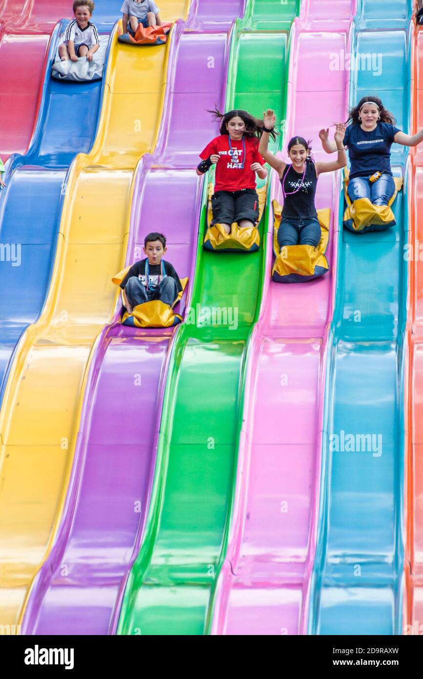 Teen teens teenagers sliding down riding hires stock photography and images Alamy