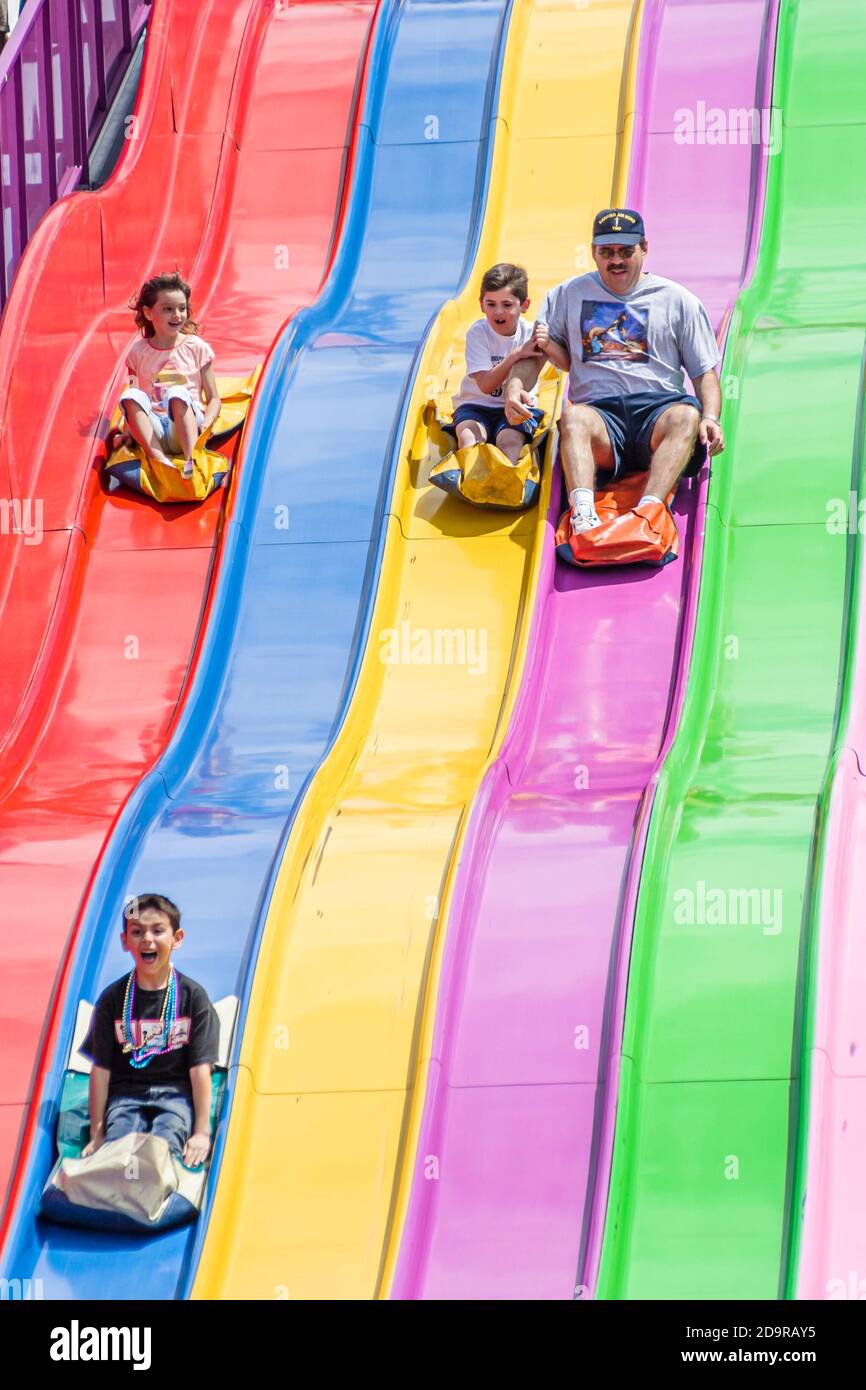 Girl sliding down the slide hi-res stock photography and images - Alamy