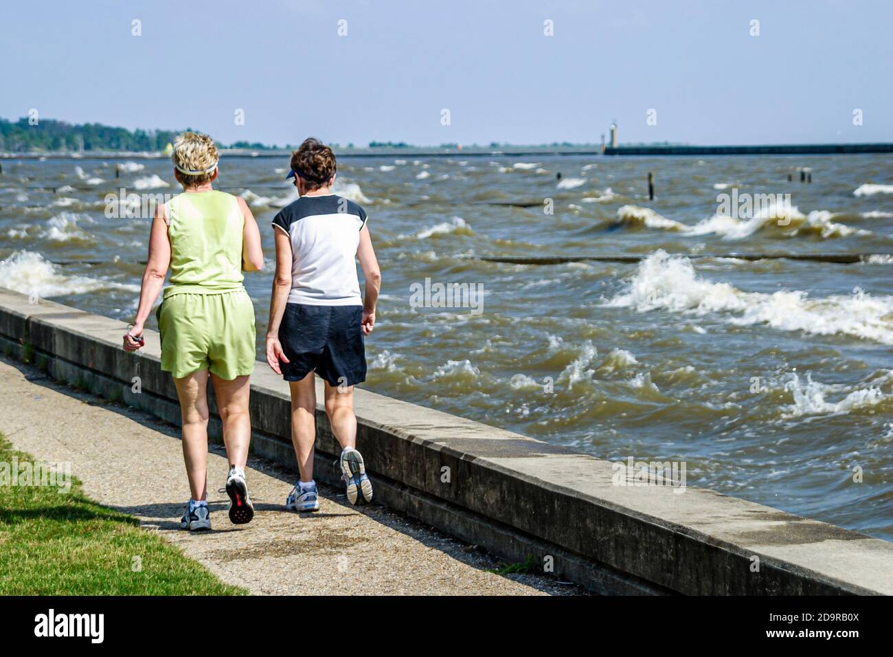 Louisiana Lake Pontchartrain Northshore,Mandeville Lakeshore Drive,woman female women senior seniors walk walking, Stock Photo