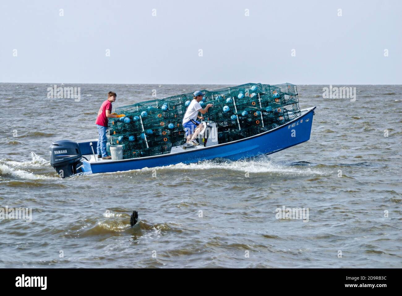 Louisiana Lake Pontchartrain Saint St. Tammany Parish Madisonville, boat loaded full filled crab traps, Stock Photo