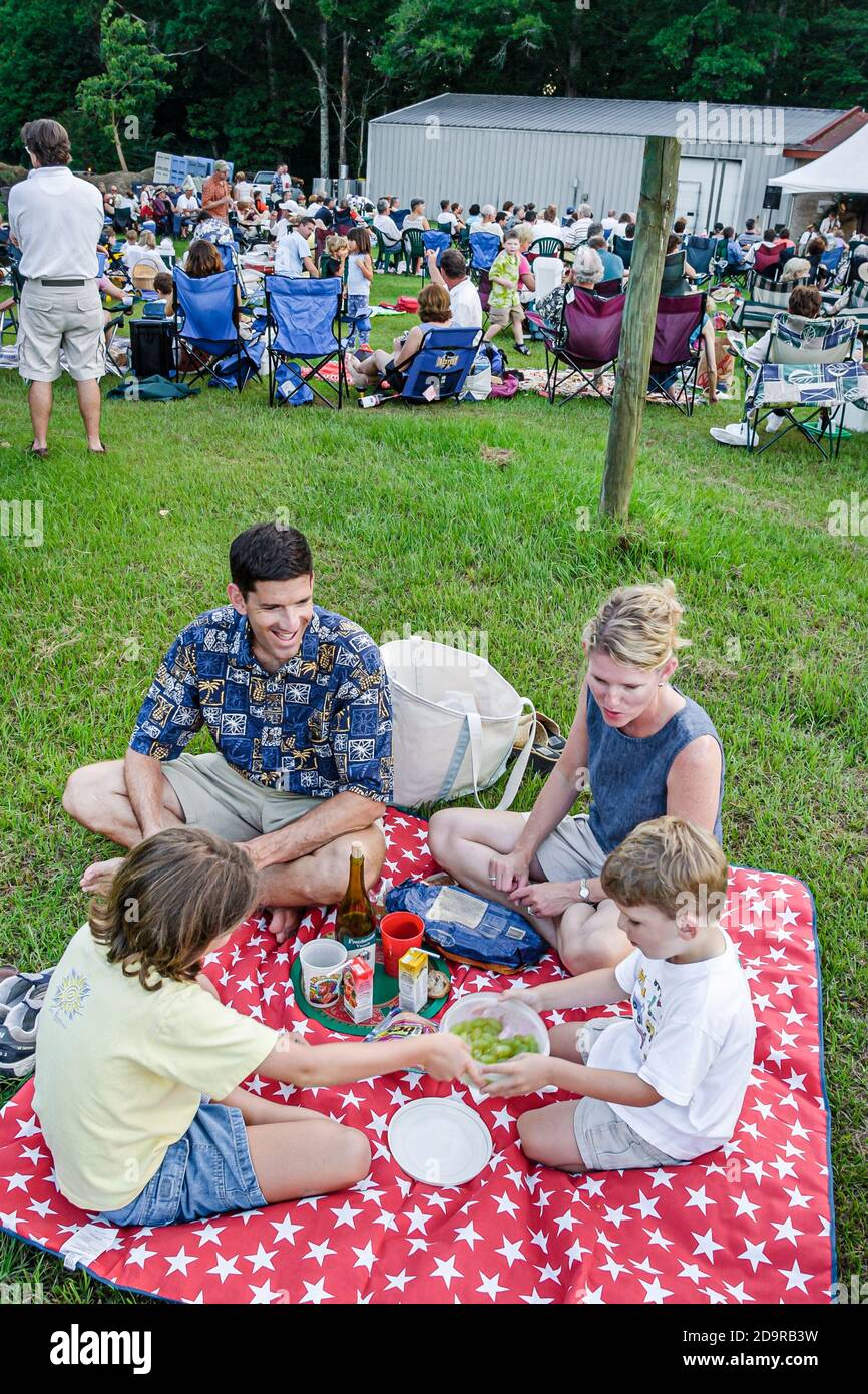 Louisiana Northshore,Mandeville Pontchartrain Vineyards,Jazz'n the Vines Outdoor Concert Series,audience family father mother children boy girl lawn p Stock Photo