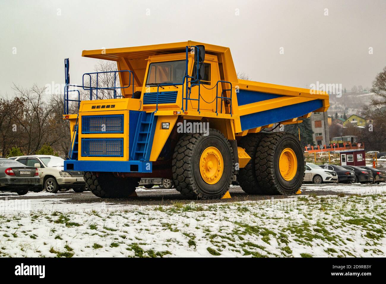 Novokuznetsk, Russia, 03.11.2020. The new BelAZ 7555 Mining dump truck is parked along with passenger cars Stock Photo