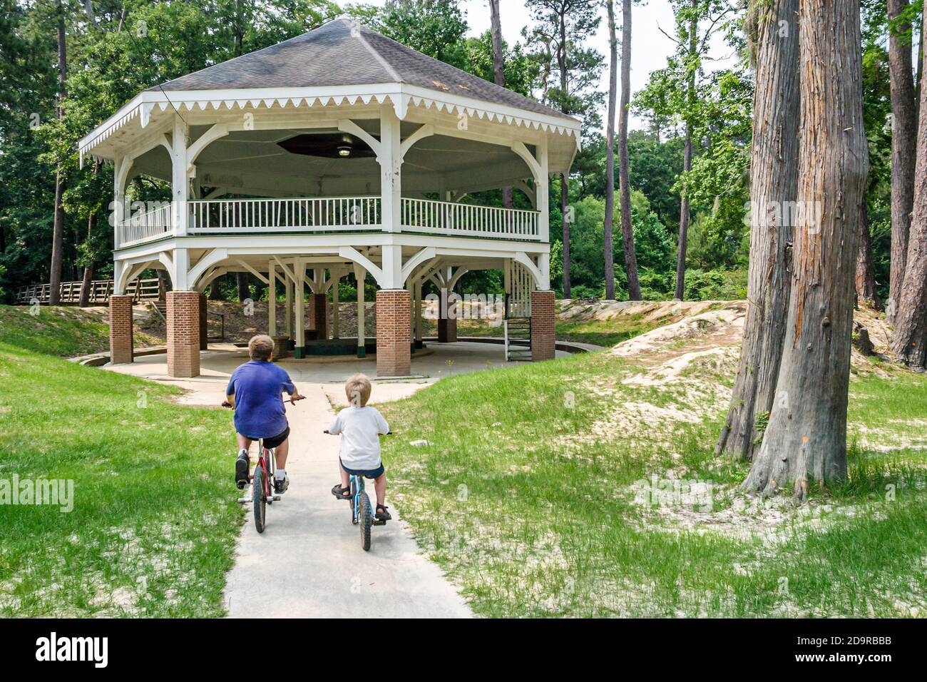 Louisiana Northshore,Abita Springs,Tourist Park pavilion community center centre,boys riding bicycles bikes, Stock Photo