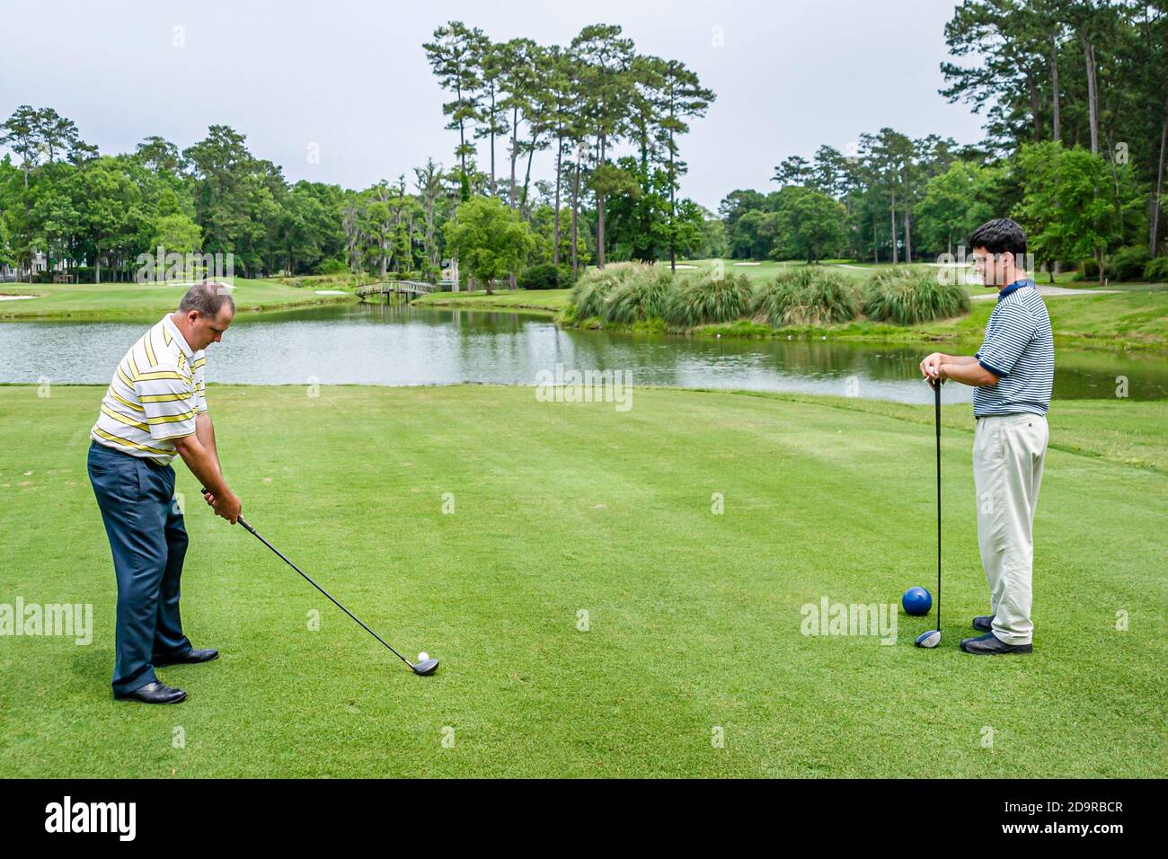 Louisiana Northshore,Mandeville,Beau Chene Country Club golf course golfers play playing tee,man men friends, Stock Photo