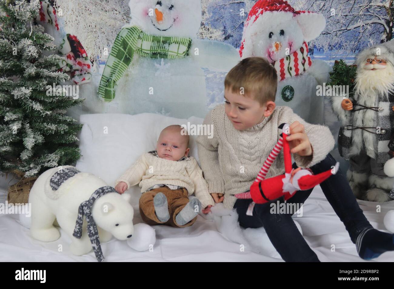 Traditional family Christmas photoshoot with a winter backdrop Stock
