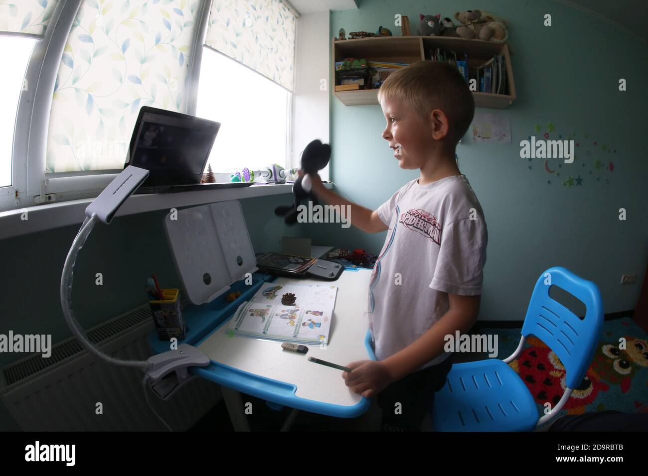 Kiev, Ukraine. 3rd Nov, 2020. A boy attends an online class at home in Kiev Oblast, Ukraine, on Nov. 3, 2020. A total of 450,934 confirmed COVID-19 cases and 8,312 deaths have been registered in Ukraine on Saturday, while 204,229 patients have recovered, according to the health ministry. A record 10,746 people tested positive for COVID-19 in the country in the past 24 hours, while 8,685 patients recovered, the ministry added. Credit: Sergey Starostenko/Xinhua/Alamy Live News Stock Photo