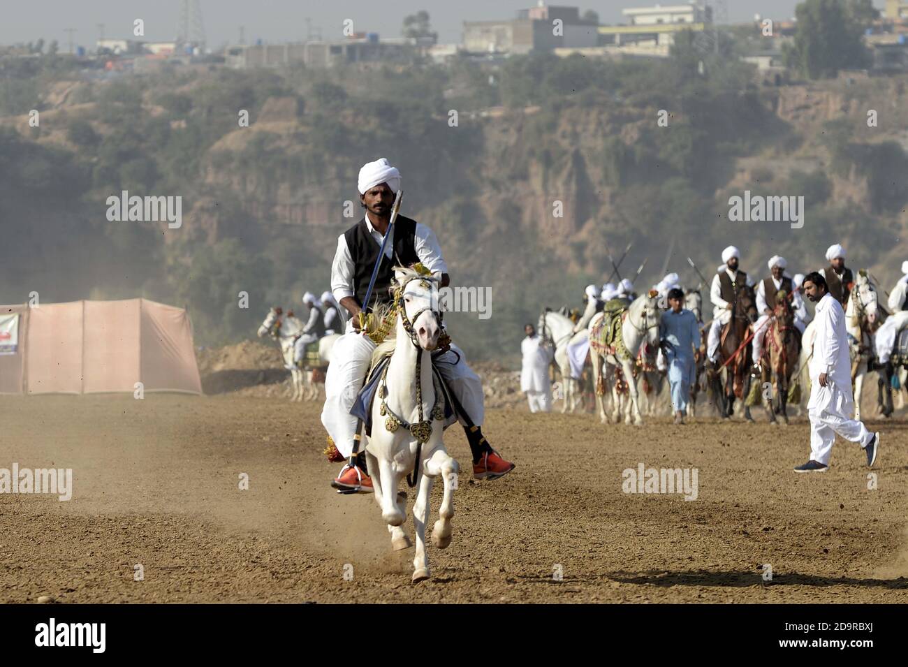 2020. A Pakistani horse rider competes 