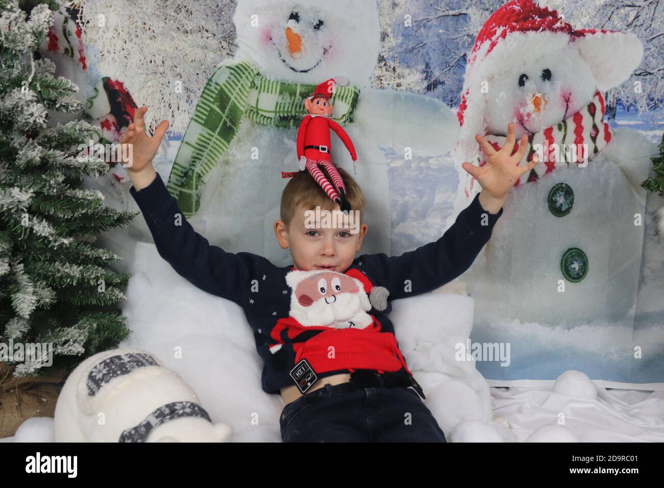 Traditional family Christmas photoshoot with a winter backdrop Stock
