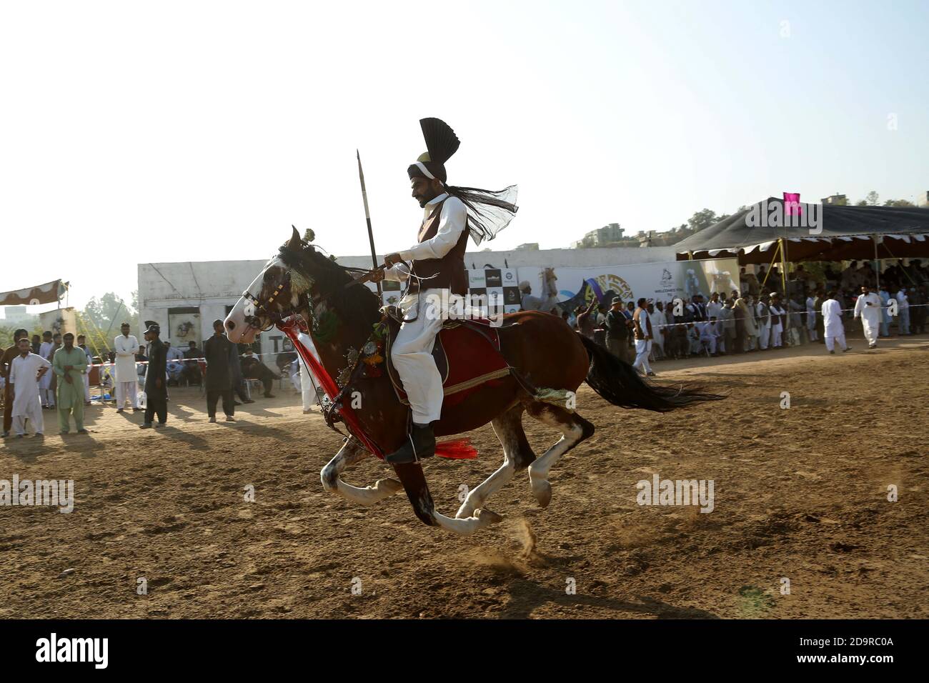 2020. A Pakistani horse rider competes 