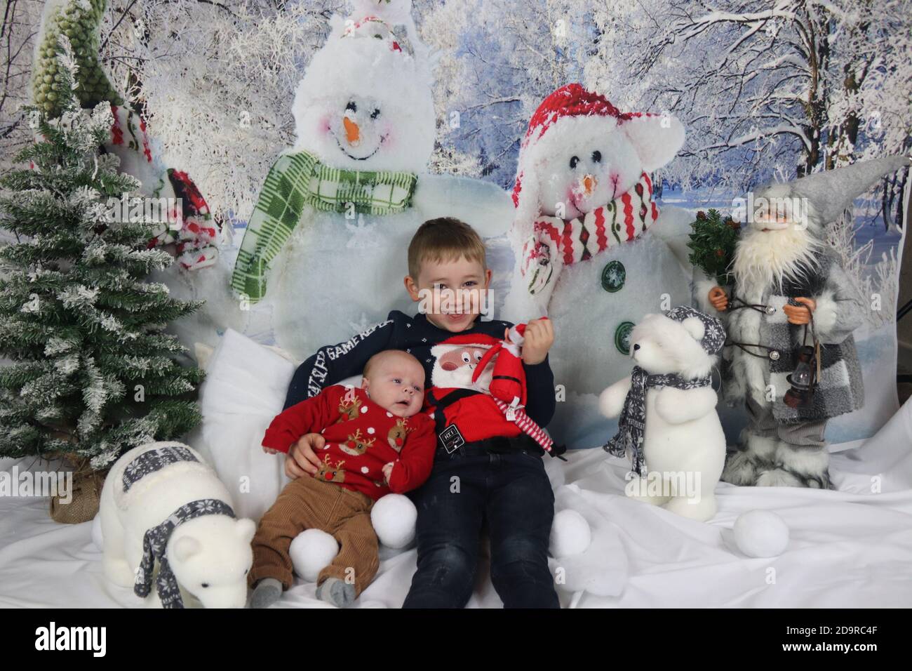 Traditional family Christmas photoshoot with a winter backdrop Stock