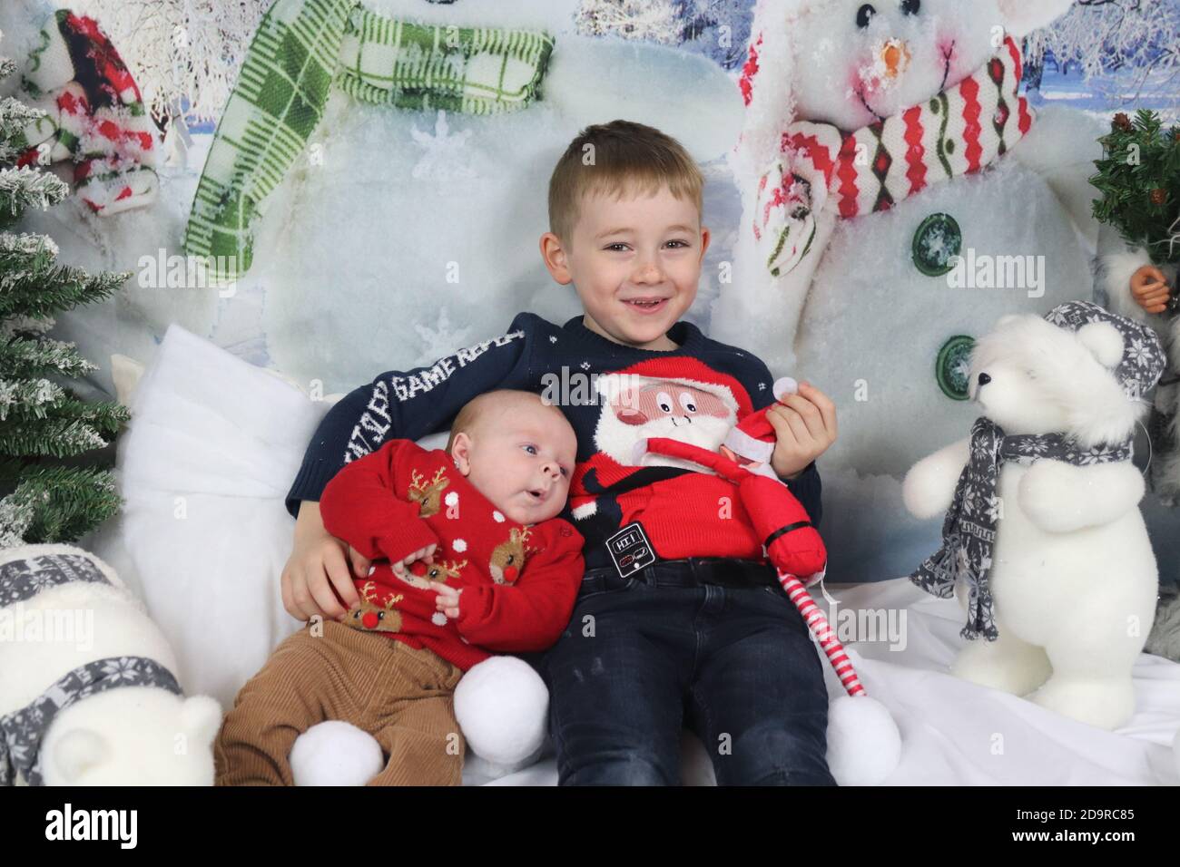 Traditional family Christmas photoshoot with a winter backdrop Stock